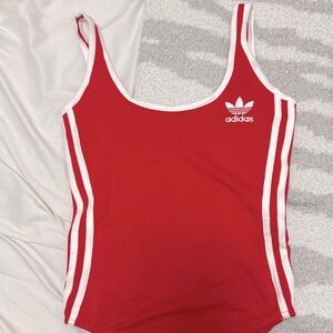 Red bodysuit with open back, never worn